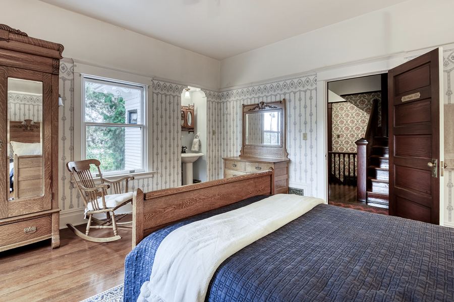 The Anglin Suite, with a mirrored wardrobe and a rocking chair
