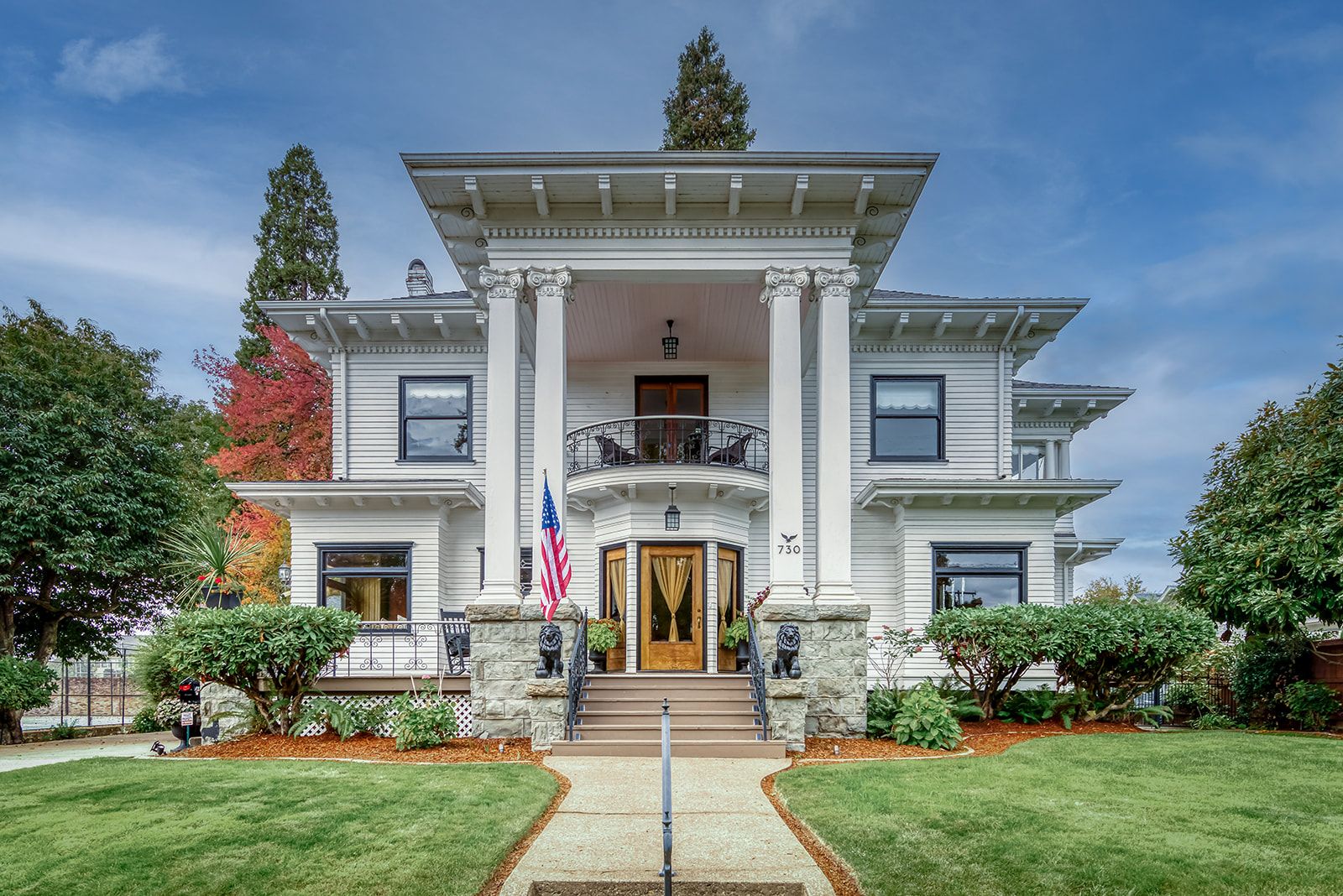 The Cathey House, a white Georgian Revival home with a two-story columned portico